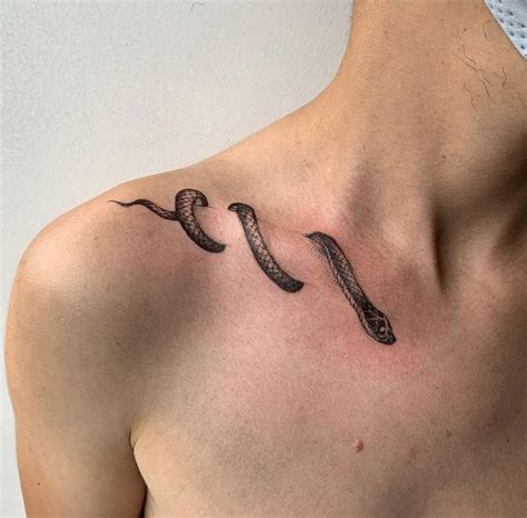 minimalist snake tattoo.